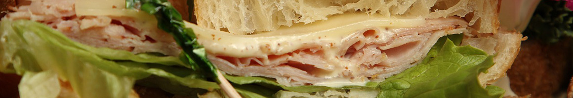 Eating Italian Pizza Sandwich at Comella's Restaurants West Roxbury restaurant in Boston, MA.